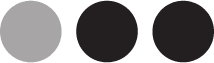 Three black circular dots aligned
